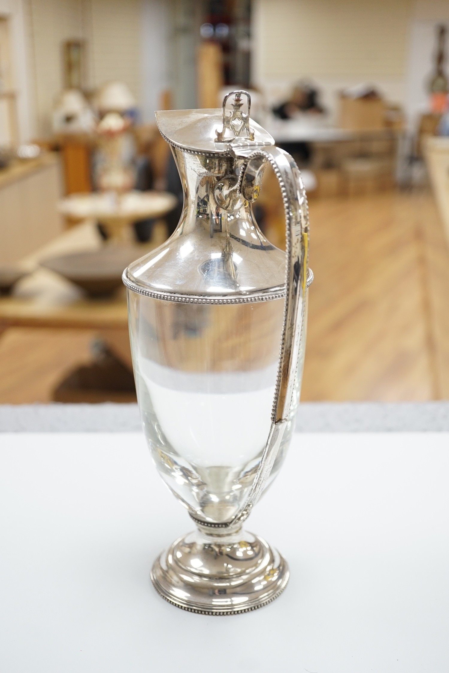 A modern silver mounted glass urn shaped claret jug, on pedestal foot, J A Campbell, London, 1981, 27.2cm.